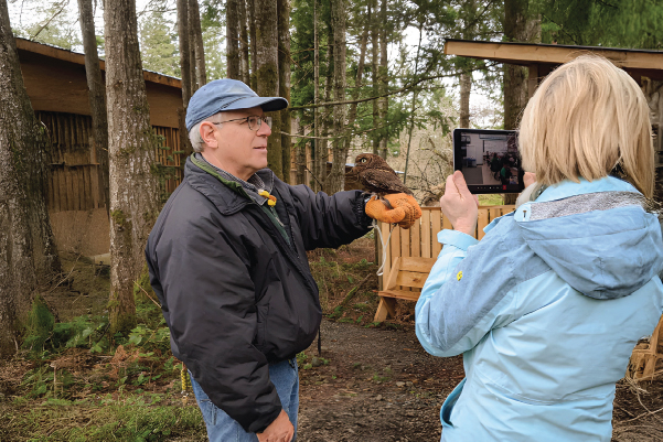 Handler with ambassador bird
